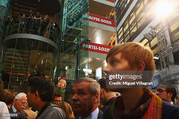 Supporters look on during the Election Night Party after first projections at the SPD headquarter on September 27, 2009 in Berlin, Germany. The SPD...