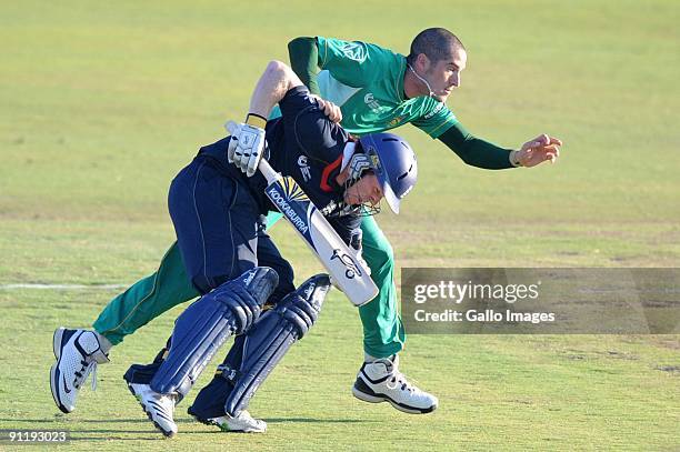Eoin Morgan of England runs into Wayne Parnell of South Africa during The ICC Champions Trophy match between South Africa and England on September...