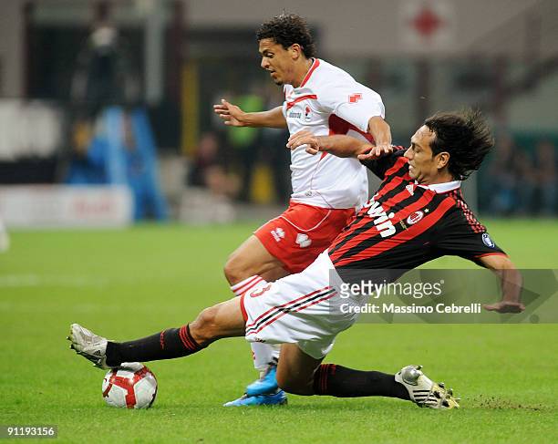 Alessandro Nesta of AC Milan and Paulo Vitor de Souza Barreto of AS Bari compete for the ball during the Serie A match between AC Milan and AS Bari...