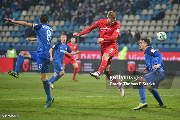 Fabian Klos of Bielefeld heads the ball past Anthony Losilla and Patrick Fabian of Bochum during the Second Bundesliga match between VfL Bochum 1848...