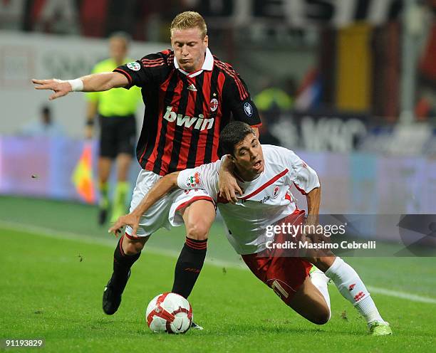 Ignazio Abate of AC Milan and Emanuel Benito Rivas of AS Bari compete for the ball during the Serie A match between AC Milan and AS Bari at Stadio...