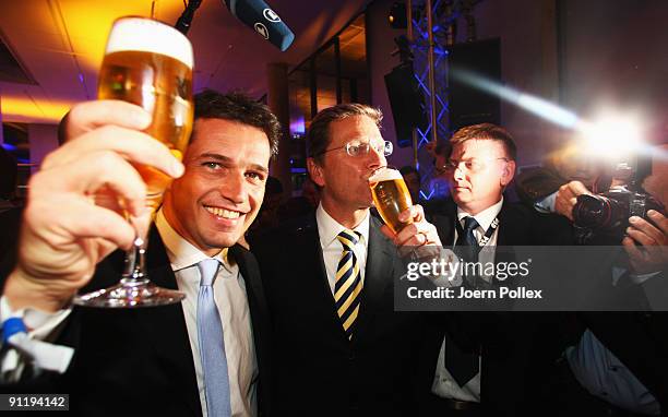 Guido Westerwelle, leader of Free Democratic Party , celebrates with his boyfriend Michael Mronz during the FDP election night party after reaching...