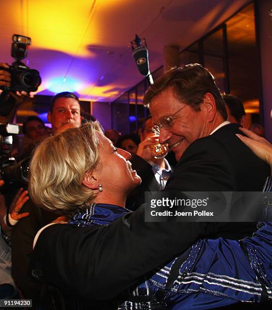 Guido Westerwelle, leader of Free Democratic Party , celebrates with Claudia Pieper during the FDP election night party after reaching 14.6 percent...