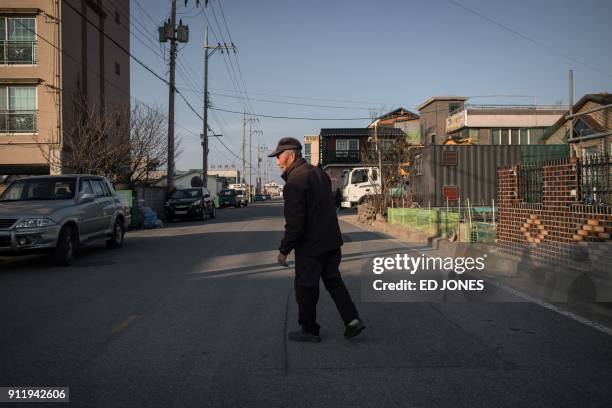 In a photo taken on January 15 North Korean refugee Kim Kun-Wook walks to his car in "Abai village", a settlement originally created by North Korean...