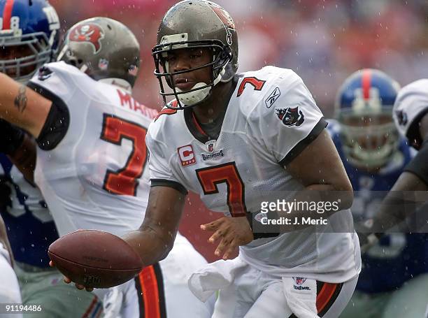 Quarterback Byron Leftwich of the Tampa Bay Buccaneers hands the ball off against the New York Giants during the game at Raymond James Stadium on...