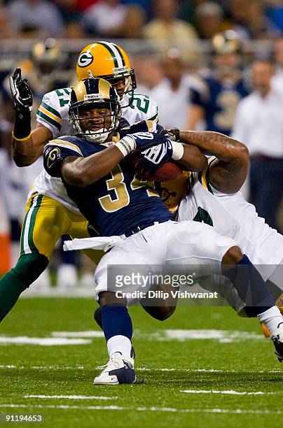 Kenneth Darby of the St. Louis Rams rushes against the Green Bay Packers at the Edward Jones Dome on September 27, 2009 in St. Louis, Missouri.