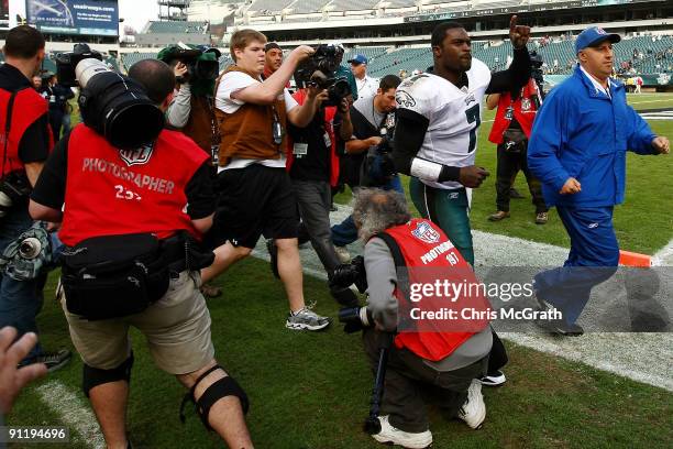 Michael Vick of the Philadelphia Eagles is swamped by media as he leaves the field after defeating the Kansas City Chiefs on September 27, 2009 at...