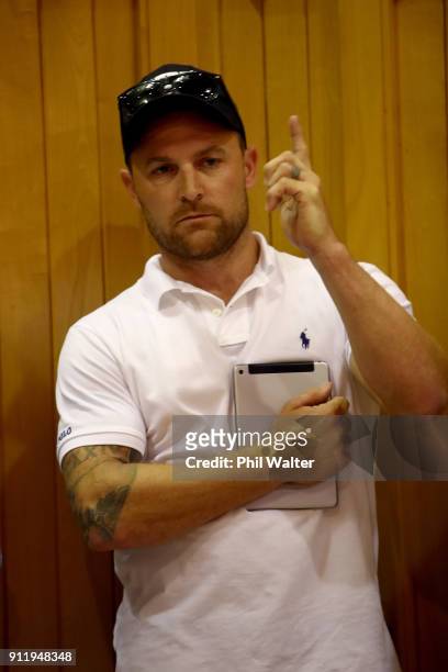 Former New Zealand Black Cap captain Brendon McCullum places a bid during the Karaka Yearling Sales at NZ Bloocstock in Karaka on January 30, 2018 in...