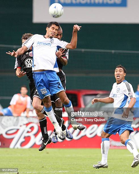 Ben Olsen and Julius James of D.C. United are beaten to a high ball by Jason Hernandez of San Jose Earthquakes during an MLS match at RFK Stadium on...