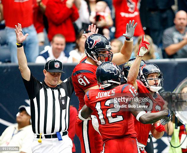 Wide receiver Kevin Walter of the Houston Texans celebrates with Owen Daniels and Jacoby Jones after his touchdown catch in the second quarter...