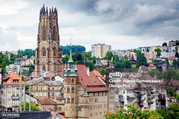 the gothic cathedral skyline of the picturesque historic walled city of fribourg, in the french speaking part of switzerland - freiburg skyline stock pictures, royalty-free photos & images