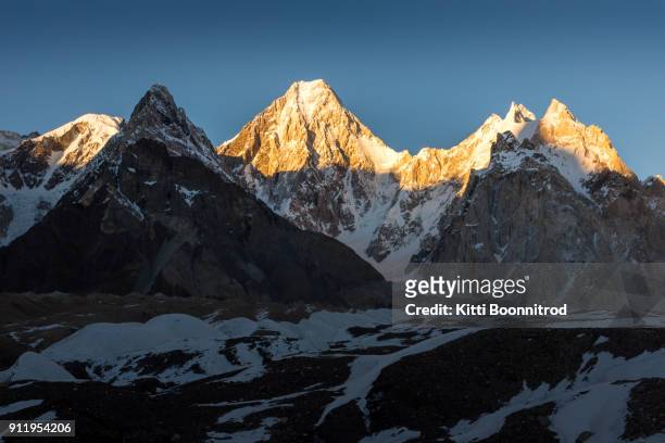 view of gasherbrum iv from baltoro glacier before sunset in pakistan - skardu stock pictures, royalty-free photos & images