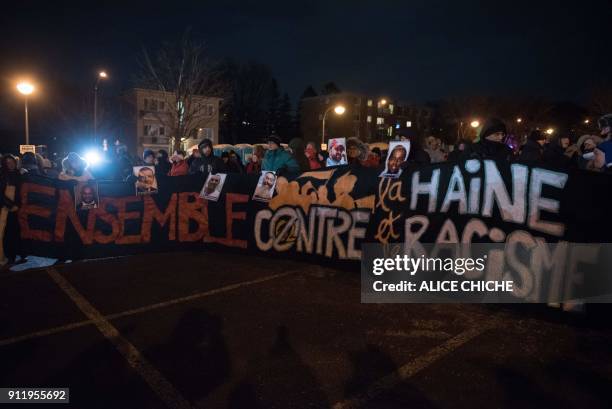 People gather at a memorial for the victims on the anniversary of the Islamic Cultural Center shooting, in Quebec City, Canada on January 29, 2018....