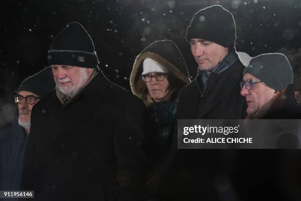 Quebec Prime Minister Philippe Couillard, Canadian Prime Minister Justin Trudeau and Quebec City Mayor Regis Labeaume attend a rally in memory of the...
