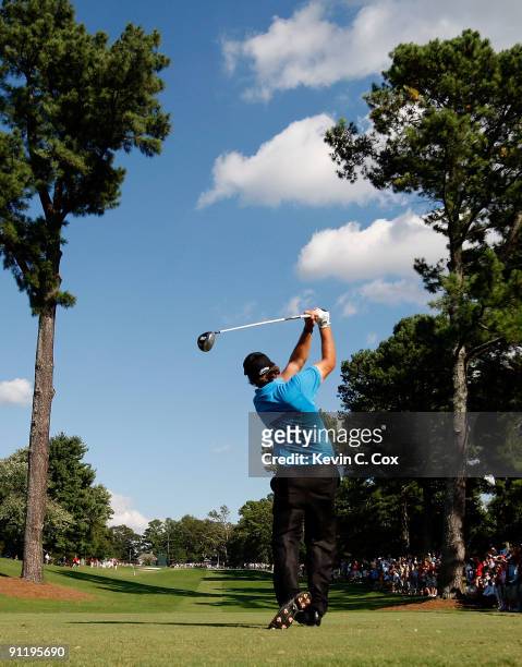 Phil Mickelson tees off the 13th hole during the final round of THE TOUR Championship presented by Coca-Cola, the final event of the PGA TOUR...