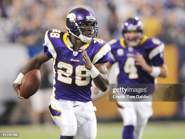 Adrian Peterson of the Minnesota Vikings carries the ball during an NFL game against the San Francisco 49ers at the Hubert H. Humphrey Metrodome, on...
