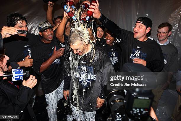 Manager Joe Girardi of the New York Yankees celebrates after his team defeated the Boston Red Sox on September 27, 2009 at Yankee Stadium in the...