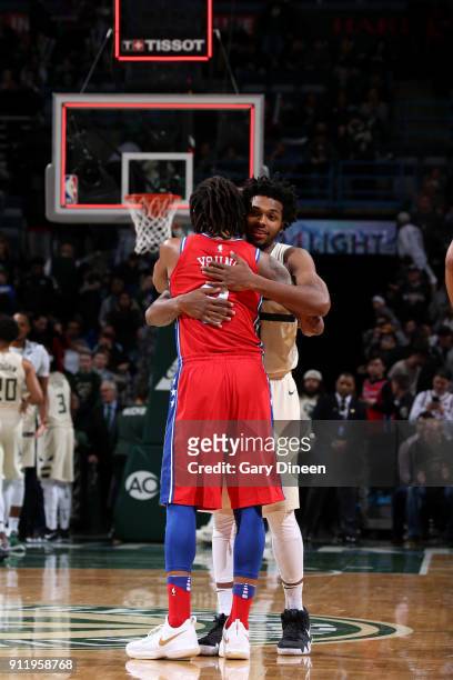 James Young of the Philadelphia 76ers hugs Sterling Brown of the Milwaukee Bucks after the game between the two teams on January 29, 2018 at the BMO...