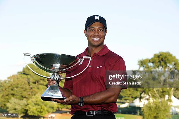 Tiger Woods holds the FedExCup Trophy after the final round of THE TOUR Championship presented by Coca-Cola, the final event of the PGA TOUR Playoffs...