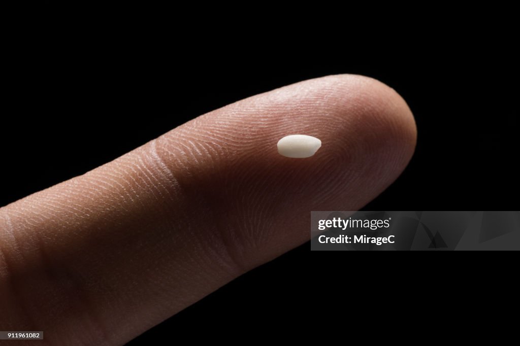 Finger Rice Check A Grain Of Rice On Tip Of Finger High-Res Stock Photo - Getty Images