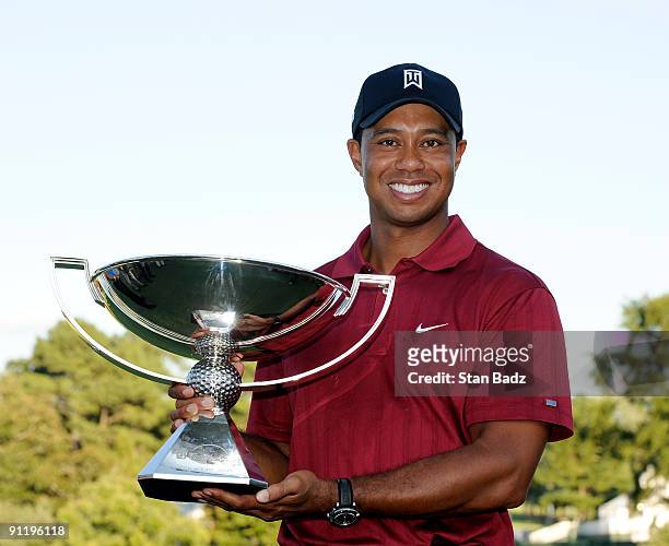 Tiger Woods holds the FedExCup Trophy after the final round of THE TOUR Championship presented by Coca-Cola, the final event of the PGA TOUR Playoffs...