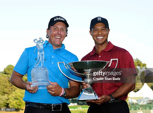 Phil Mickelson, left, wins THE TOUR Championship and Tiger Woods, right, wins the FedExCup after the final round of THE TOUR Championship presented...
