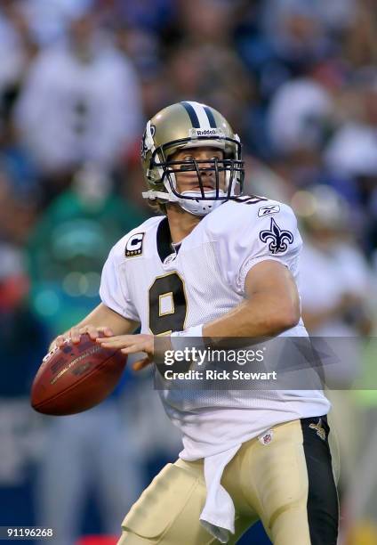 Drew Brees of the New Orleans Saints readies to pass against the Buffalo Bills at Ralph Wilson Stadium on September 27, 2009 in Orchard Park, New...
