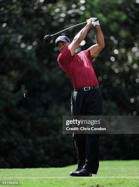 Tiger Woods tees off on during the final round of THE TOUR Championship presented by Coca-Cola, the final event of the PGA TOUR Playoffs for the...