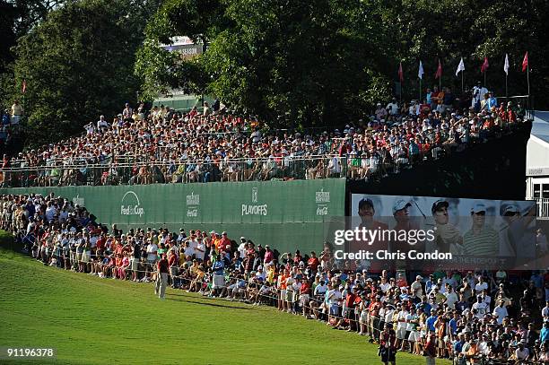 Spectators gather on during the final round of THE TOUR Championship presented by Coca-Cola, the final event of the PGA TOUR Playoffs for the...