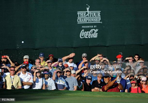 Tiger Woods hits from a bunker on during the final round of THE TOUR Championship presented by Coca-Cola, the final event of the PGA TOUR Playoffs...