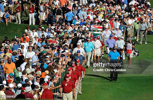 Phil Mickelson walks to the 18th green during the final round of THE TOUR Championship presented by Coca-Cola, the final event of the PGA TOUR...