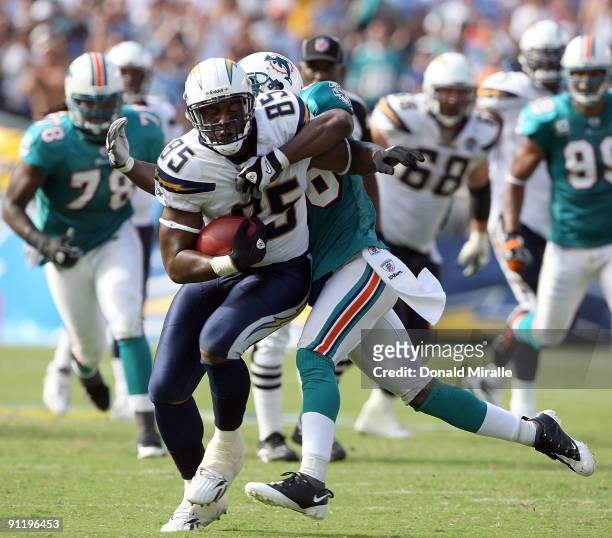 Tight-End Antonio Gates of the San Diego Chargers runs with the ball after the catch against the Miami Dolphins at Qualcomm Stadium on September 27,...