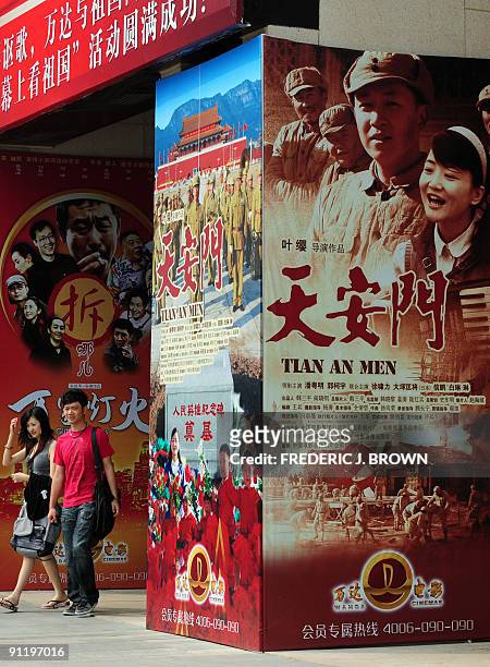 Entertainment-China-politics-60years by Francois Bougon This photo taken September 16, 2009 shows a couple leaving a cinema in Beijing. China is...