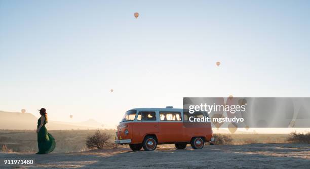 hot air balloons flying over valley in the morning. cappadocia. turkey - vw kombi stock pictures, royalty-free photos & images