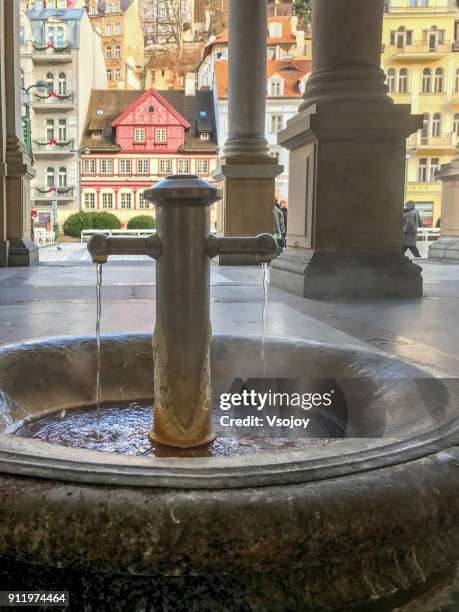 spring water at the mill colonnade, karlovy vary, czech republic - karlovy vary stock pictures, royalty-free photos & images