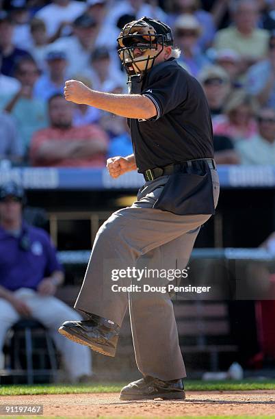 Homeplate umpire Larry Vanover calls a strike out as the St. Louis Cardinals face the Colorado Rockies at Coors Field on September 27, 2009 in...