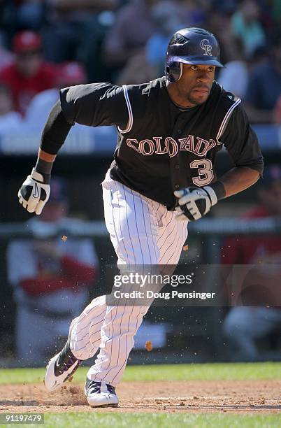 Eric Young Jr. #3 of the Colorado Rockies heads for first base as he takes an at bat against the St. Louis Cardinals at Coors Field on September 27,...