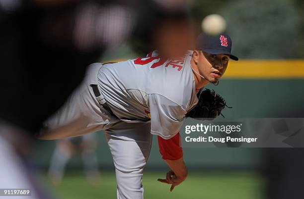 Starting pitcher Kyle Lohse of the St. Louis Cardinals delviers against the Colorado Rockies at Coors Field on September 27, 2009 in Denver,...