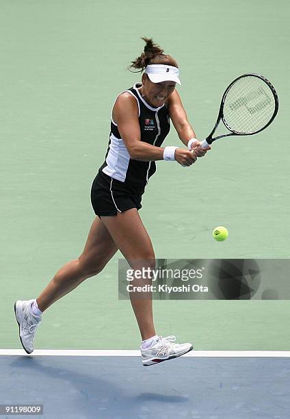 Ai Sugiyama of Japan returns a shot in in her first round match against Nadia Petrova of Russia on day two of the Toray Pan Pacific Open Tennis...