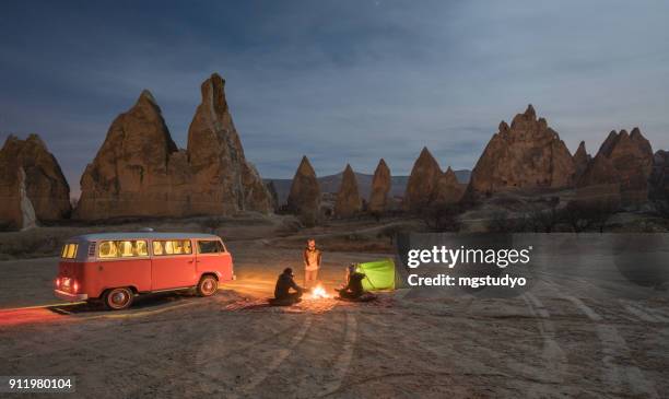 people are camping in moonlight in cappadocia, turkey - vw kombi stock pictures, royalty-free photos & images