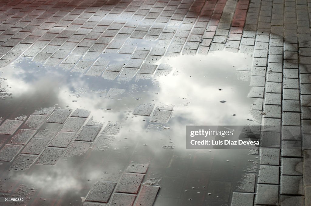 Reflection in a puddle of clouds