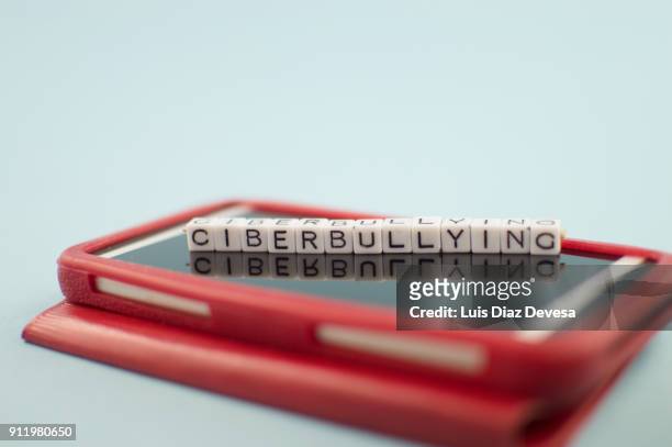 some people are using their mobile phones for making ciberbullying - addiction mobile and laptop stock-fotos und bilder