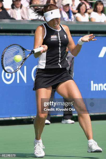 Ai Sugiyama of Japan returns a shot in her first round match against Nadia Petrova of Russia on day two of the Toray Pan Pacific Open Tennis...