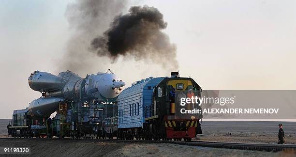 Russian Soyuz TMA-16 rocket is transported by train to its launch pad at Kazakhstan's Russian-leased Baikonur cosmodrome on September 28, 2009. The...