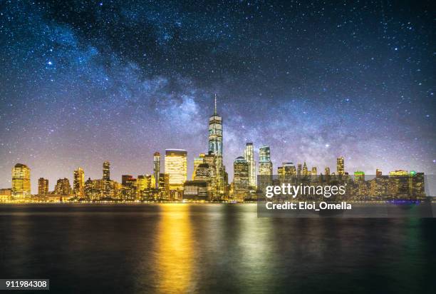 night new york manhattan downtown skyline milky way reflection - manhattan stad new york stock pictures, royalty-free photos & images