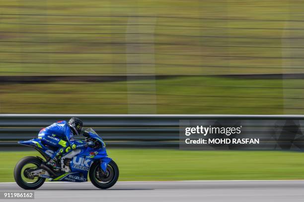 Team Suzuki Ecstar's Italian rider Andrea Iannone steers his bike during the last day of the 2018 MotoGP pre-season test at the Sepang International...