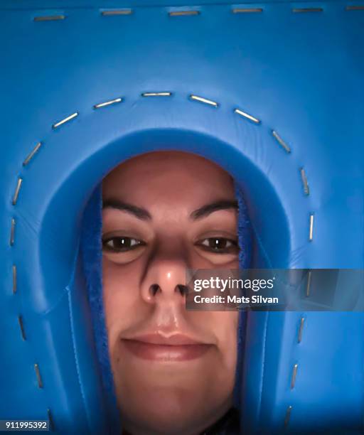 woman lying on a massage bed, seen directly below - heads looking up stock-fotos und bilder