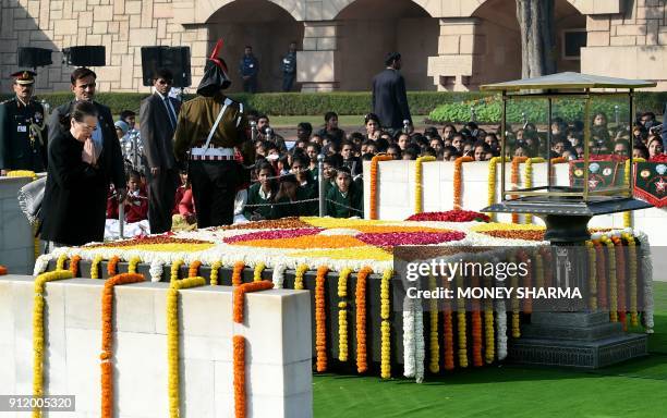 Former Congress Party president Sonia Gandhi pays homage at Rajghat, the memorial for Indian independence icon Mahatama Gandhi, on Martyr's Day to...