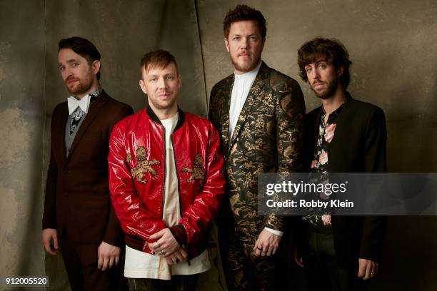 Recording artists Daniel Platzman, Ben McKee, Dan Reynolds, and Wayne Sermon of musical group Imagine Dragons pose for a photo during MusiCares...