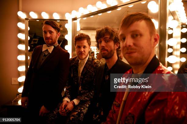Recording artists Daniel Platzman, Dan Reynolds, Wayne Sermon and Ben McKee of musical group Imagine Dragons pose for a photo during MusiCares Person...